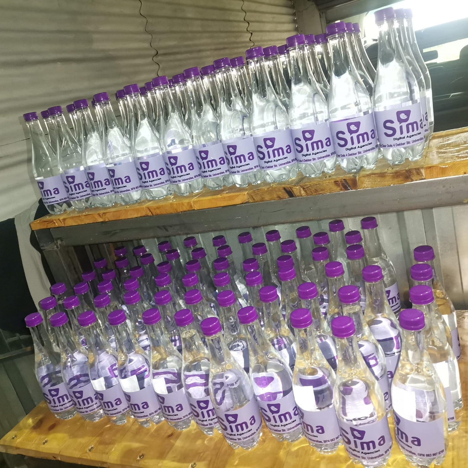 Sima-branded water prepared for community distribution